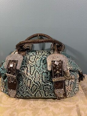 Charm and Luck leather purse with faux snakeskin detail and rhinestone embellish